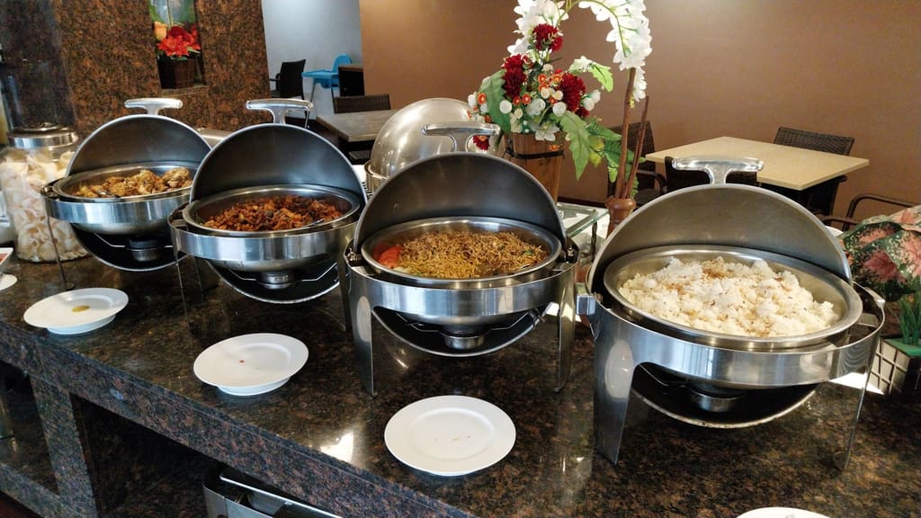 Buffet service counter with a variety of dishes on display