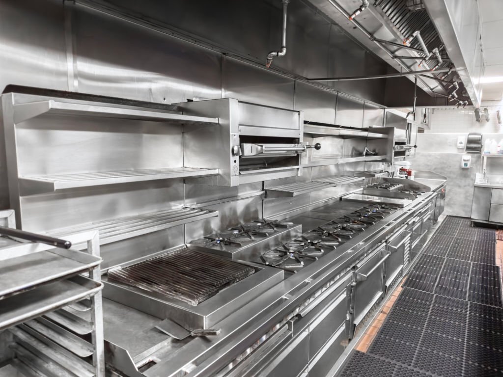 Stainless steel commercial cooking line with integrated prep and service equipment